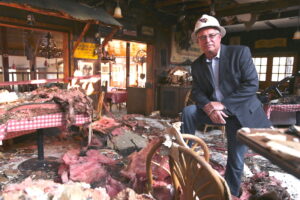 Jim O'Toole sitting in a restaurant fire site.